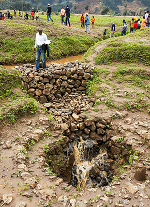 People visiting a stormwater drainage project in Rwanda