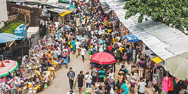 Street market crowd at Lagos Island's commercial district in Nigeria.
