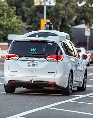 A Waymo car on the road.